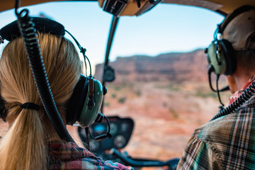 Woman Taking A Helicopter Hiking Tour In The Remote Deserts Of The Utah Canyonlands © SIX60SIX
