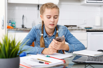 Portrait of girl doing herself home task