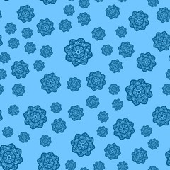 Many blue snowflakes on light blue background for Xmas wrapping paper
