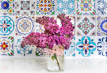 Bouquet of Purple Lilac on Italian Tiles Background.Spring Background