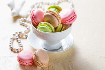 Colourful macaroons on the plates