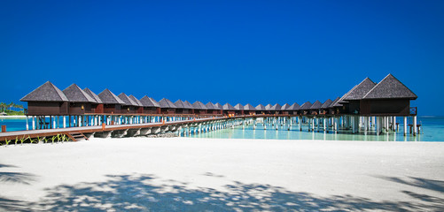 Beautiful tropicalresort hotel with beach and blue water for relax on Olhuveli island, Maldives.
