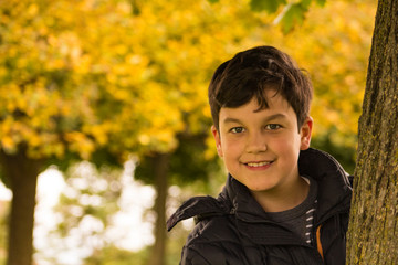 boy in leaves