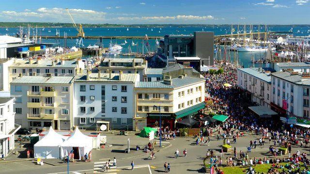 Brest, France - July 14, 2016: Cinemagraph on the Brest International Maritime Festival in summer 2016 - Timelapse above the crowd - old rigging and sailing ships.