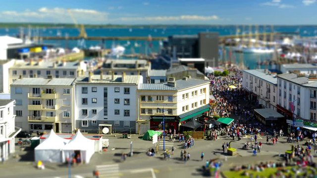 Brest, France - July 14, 2016: Timelapse in the Brest International Maritime Festival in summer 2016 - Tilt shift effect on the crowd moving fast.