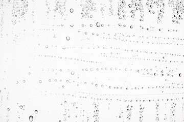 white isolated background water drops on the glass / wet window glass with splashes and drops of water and lime, texture autumn background