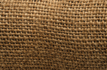 Burlap texture background closeup. tied little ropes