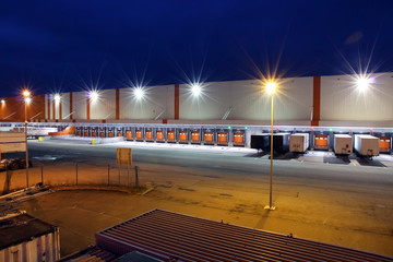 gates for trucks on a warehouse at night
