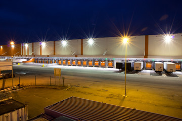 gates for trucks on a warehouse at night