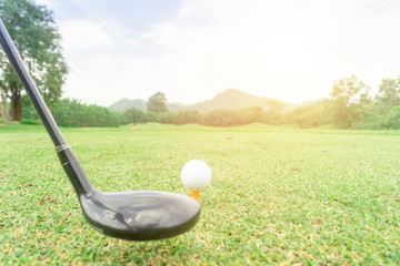 golf ball on green grass ready to hit from t-off in beautifull tropical golf course for background...