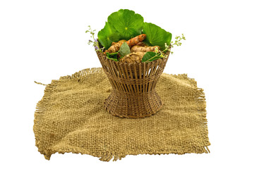 Assorted of herbal in brown bamboo basket  on sack sisal isolate on white background