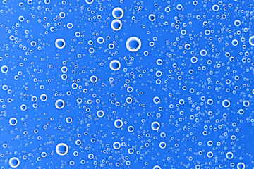 fresh drops background blue glass / wet rainy background, water drops transparent glass blue