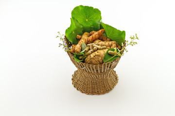 Assorted of herbal in brown bamboo basket   isolate on white background