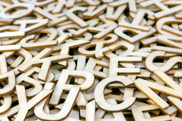 Pile of Mixed Wooden Letters Close Up