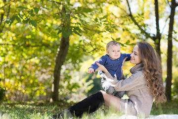 Fototapeta premium mother with baby in autumn park
