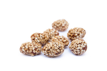 Coated peanuts with sesame isolated on white background