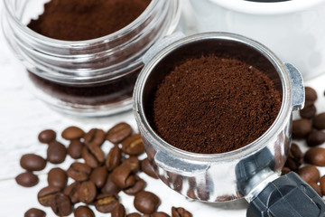 holder with aroma ground coffee on table, top view