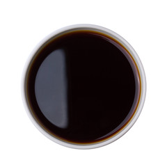 Top view of dish with tasty soy sauce isolated on white background.