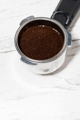 holder with ground coffee for coffee machine, vertical top view