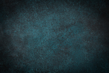 Dark green slate background. Stone or concrete surface