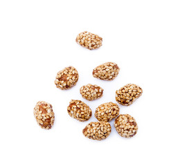 Coated peanuts with sesame isolated on white background
