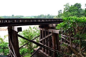 Fototapeta na wymiar River Kwai train crossing the Wampoo Viaduct on the Death Railway above the River Kwai valley near Nam Tok, Kanchanaburi
