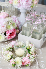 Bottles with lemonade and floral party decorations