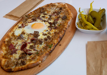 traditional turkish pide pita pizza with egg