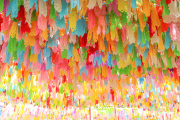 A lot of multicolored mulberry paper lanterns on background ,Hanging decorations for celebration loy krathong festival in lamphun of Thailand