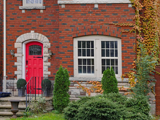 Fototapeta na wymiar house front door with vines in fall colors