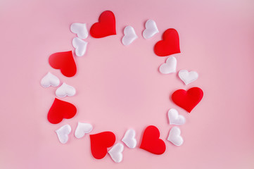 Pattern of red and white hearts on a pink background. Romantic concept for Valentine's Day.