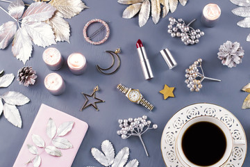 Jewelry and cosmetics with Christmas decorations and ornaments. Beauty blog, winter concept. Top view