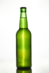 Green beer bottle. Isolated on white.