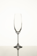 Empty wine glass isolated on white. Close up. One single fragile wine glass.