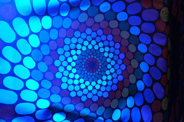 Spinning RGB colored hallucination on a wall