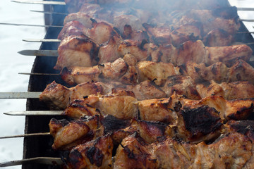 a shish kebab is grilled on a grill with a smoke