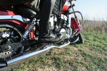 the details. Close portrait of leather boots on a motorcycle pedal, bike. Bikers.