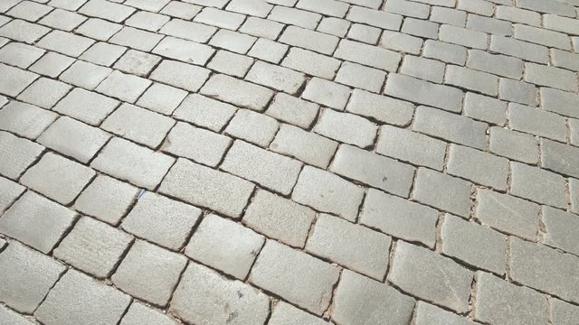 The road is made of stone bricks. Video in motion.