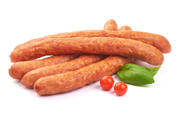 Hungarian dry sausages with basil leaves, isolated on a white background. Close-up.