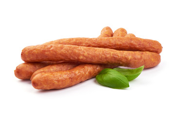 Sausages for beer. Oktoberfest sausages with basil leaves, isolated on a white background. Close-up.