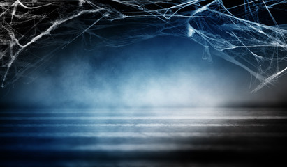 Cobweb in the basement at night, neon light, smoke, fog, concrete, smog. Halloween background