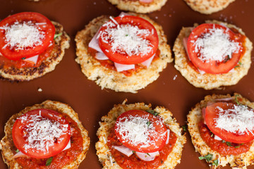 Preparation of paleo cauliflower pizza with ham