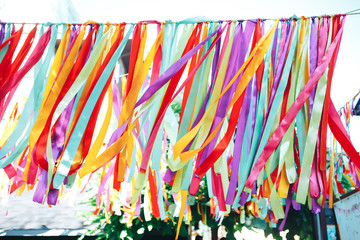 Multicolored ribbons fluttering in the wind. Silk ribbons in the wind