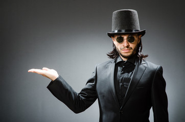 Vintage concept with man wearing black top hat