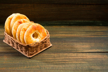 Pandequeso traditional Colombian food. Wood background