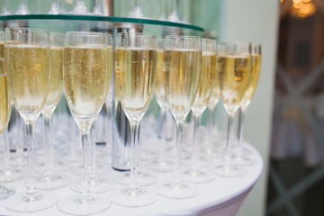 glasses with sparkling wine at corporate party