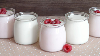 yogurt jars and fresh raspberries