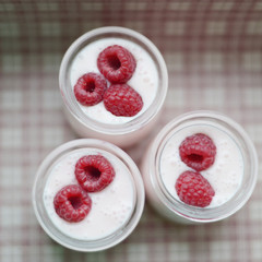 yogurt jars and fresh raspberries
