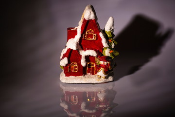Close up view of christmas decoration isolated. Cute house for candles. Beautiful christmas backgrounds.