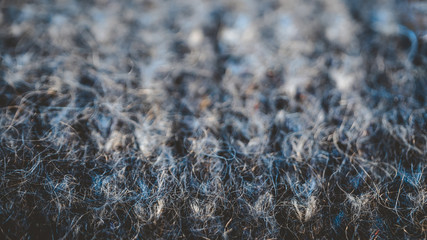 Knitted mohair cloth close-up background with selected focus